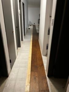 Installing engineered hardwood floors by Catalyst Vernon’s Home Improvement Refresh Specialists